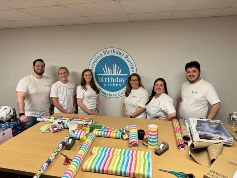 Needham Bank team members at Birthday wishes charity wrapping gifts